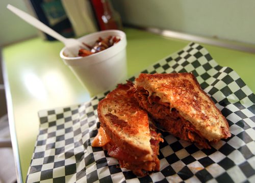 Review - hand-pulled pork w/slaw (actually a grilled cheese with bacon/cheddar/mozza) - their most popular sandwich at the White Star, See Marion Warhaft's Sandwich Shop reviews.  July 20, 2015 - (Phil Hossack / Winnipeg Free Press)