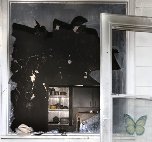 Fire damaged interior of a house at 676  Pritchard Ave., the police homicide unit is investigating after a body was removed from the house that burned early Monday. Wayne Glowacki / Winnipeg Free Press July 21 2015 ¤