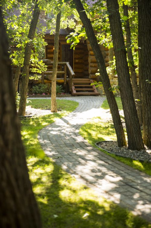 This log home in Charleswood provides a rustic lodge feeling within the city limits in Winnipeg on Tuesday, July 21, 2015.   Mikaela MacKenzie / Winnipeg Free Press