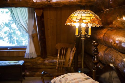 The master bedroom has a cozy feel with a sloped ceiling in this Charleswood home in Winnipeg on Tuesday, July 21, 2015.   Mikaela MacKenzie / Winnipeg Free Press