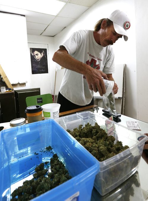 Glenn Price began selling medical marijuana again Tuesday morning at his shop, Your Medical Cannabis Headquarters on Main Street despite a police order last Tuesday to stop.  Aidan Geary story Wayne Glowacki / Winnipeg Free Press July 21 2015