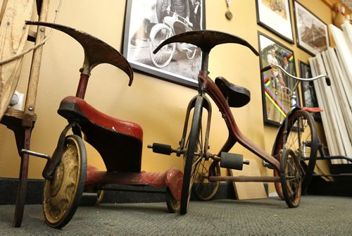 Sunday. This City. The story is on Woodcock Cycle Works and owner Tim Woodcock.  These are 1940's to 50's tricycles in his office.  Dave Sanderson story Wayne Glowacki / Winnipeg Free Press July 21 2015