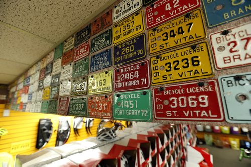 Sunday. This City. The story is on Woodcock Cycle Works and owner Tim Woodcock. Some of the bicycle license plates on display in the store.  Dave Sanderson story Wayne Glowacki / Winnipeg Free Press July 21 2015