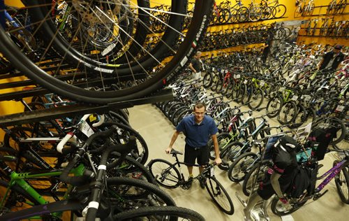 Sunday. This City. The story is on Woodcock Cycle Works and owner Tim Woodcock. Tim in the bike showroom in the store.  Dave Sanderson story Wayne Glowacki / Winnipeg Free Press July 21 2015