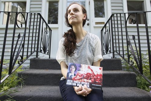 July 21, 2015 - 150721  -  Toby Cygman is photographed on her front steps with a brochure informing home owners of Justin Trudeau's position on abortion Tuesday July 21, 2015. Cygman is upset about the graphic content and feels the content is hate mail. John Woods / Winnipeg Free Press