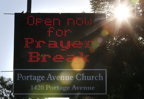 The sign in front of the Portage Avenue Church. Through out the summer church members are out 7:30 to 8:30am and 4:30 to 5:30pm on Wednesdays praying and offering a chance for commuters to stop and pray.  Brenda Suderman Faith Page  story Wayne Glowacki / Winnipeg Free Press July 22 2015