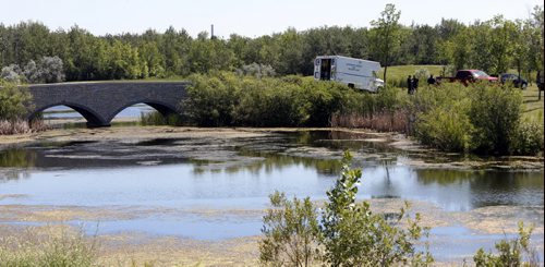 Members of the Winnipeg Police Underwater Search and Recovery Unit in Kilcona Park Wednesday afternoon as the search continues for Thelma Krull.  Wayne Glowacki / Winnipeg Free Press July 22 2015