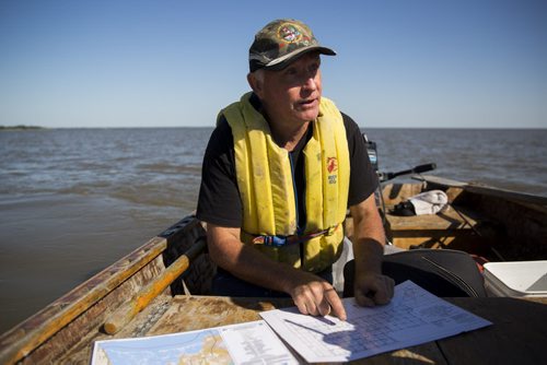 Charlie MacPherson explains recent changes in the ecosystem at the Netley-Libau March just off Lake Winnipeg on Wednesday, July 22, 2015.  Because of continuous high water levels, the marsh is suffering in many ways. Mikaela MacKenzie / Winnipeg Free Press