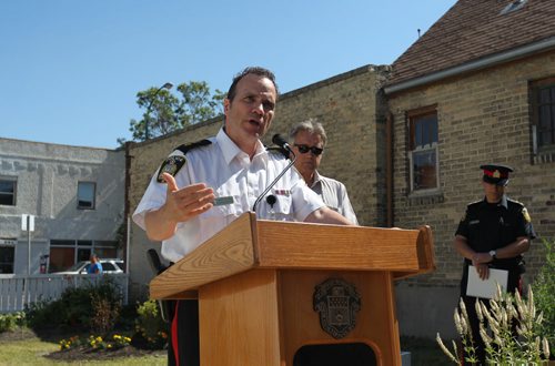 The Winnipeg Police hold media briefing regarding the release of Winnipeg Police Service's 2014 Annual Report at Selkirk Community Garden Wednesday morning.  Superintendent Danny Smyth (in white uniform),  City councillor Ross Eadie, Mynarski ward was also in attendance backing the report.      July 22,, 2015 Ruth Bonneville / Winnipeg Free Press
