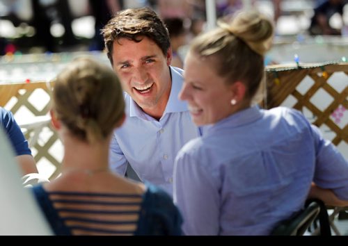 Liberal Leader Justin Trudeau banters with participants at the Winnipeg Fringe Festival Wednesday afternoon as he dropped by Old Market Square for a visit. See Geoff Kirbyson's story. July 22, 2015 - (Phil Hossack / Winnipeg Free Press)