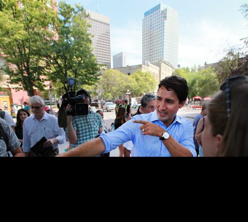 Liberal Leader Justin Trudeau banters with poarticipants at the Winnipeg Fringe Festival Wednesday afternoon as he dropped by Old Market Square for a visit. See Geoff Kirbyson's story. July 22, 2015 - (Phil Hossack / Winnipeg Free Press)