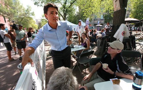 Liberal Leader Justin Trudeau banters with participants at the Winnipeg Fringe Festival Wednesday afternoon as he dropped by Old Market Square for a visit. See Geoff Kirbyson's story. July 22, 2015 - (Phil Hossack / Winnipeg Free Press)