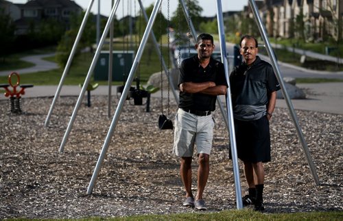 Anis Khan, left, and Dost Mughal, in what will soon be named "Malala Park," at the southern end of Paddington Road, named after Pakistan's Malala Yousafzai, Wednesday, July 22, 2015. (TREVOR HAGAN/WINNIPEG FREE PRESS)