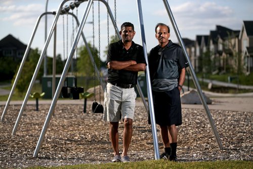 Anis Khan, left, and Dost Mughal, in what will soon be named "Malala Park," at the southern end of Paddington Road, named after Pakistan's Malala Yousafzai, Wednesday, July 22, 2015. (TREVOR HAGAN/WINNIPEG FREE PRESS)