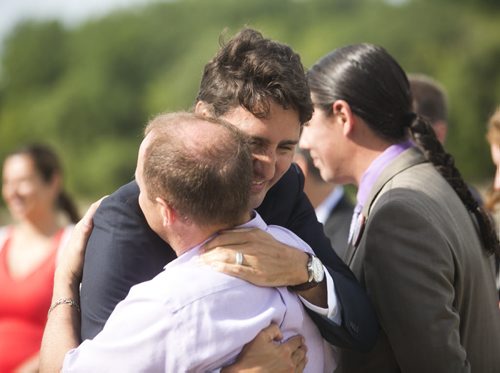 Liberal leader Justin Trudeau hugs a minister after speaking at the Taché Promenade in Winnipeg on Thursday, July 23, 2015.  Mikaela MacKenzie / Winnipeg Free Press