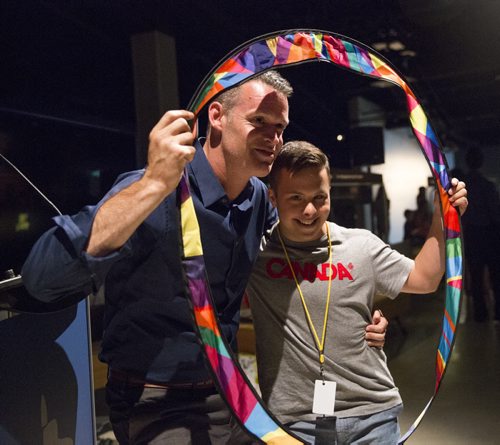 Mark Tewksbury, openly gay Olympic gold medalist, poses with Special Olympics golfer Domenec Mohammed at the Canadian Museum of Human Rights in Winnipeg on Thursday, July 23, 2015.  Mikaela MacKenzie / Winnipeg Free Press