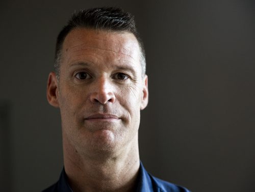 Mark Tewksbury, openly gay Olympic gold medalist, poses for a portrait after lending his medal to the Canadian Museum of Human Rights in Winnipeg on Thursday, July 23, 2015.  Mikaela MacKenzie / Winnipeg Free Press