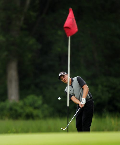 Devon Schade chips onto the 15th green at the Manitoba Amature Thursday afternoon at Bridges Golf Course in Starbuck Mb.  Schade came in to win the tournament while Ryan Sholdice finished 2nd in the provincial title. See Story. July 23, 2015 - (Phil Hossack / Winnipeg Free Press)