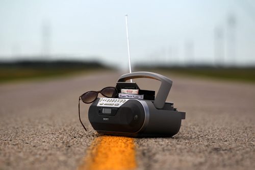 49.8 Feature on Road Trip Tunes Photo illustration of ghetto blaster, tape player, on yellow line in middle of Highway to illustrate what to listen to on long road trip. Photo taken on Hwy 322, near Teulon Manitoba.     July 23,, 2015 Ruth Bonneville / Winnipeg Free Press