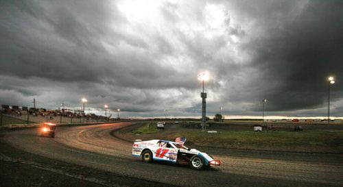 Pace cars paraded the flags of Canada and the USA at Red River Raceway Thursday evening. Racers prepped under the looming weather and got one race in before the sky opened up and cancelled the races till Monday night. July 23, 2015 - (Phil Hossack / Winnipeg Free Press)