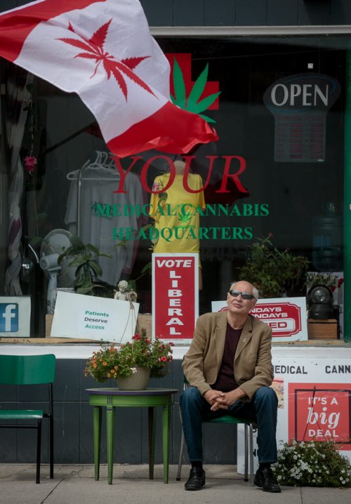 Bill Vandergraaf, a former police officer who advocates for medical marijuana rights sits outside Your Medical Cannabis Headquarters. Thursday afternoon. The Main Street shop has thrust the regulation of medical marijuana into the spotlight, as it continues to sell marijuana to prescription-holding customers despite a police order to stop, because it is not licensed by Health Canada to do so.    July 23, 2015 - MELISSA TAIT / WINNIPEG FREE PRESS