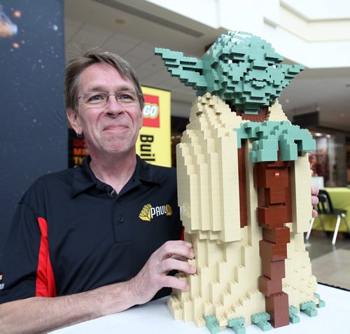 Lego Master Paul Chrzan was in Winnipeg for the Lego Master builder event  at Polo Park Shopping where local kids get a chance to pitch in and build a over 2 meter high Star Wars Joda character- Chrzan poses by a replica of the Joda they are building- See Geoff Kirbyson story- July 24, 2015   (JOE BRYKSA / WINNIPEG FREE PRESS)