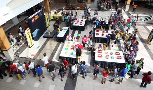 Lego Master Paul Chrzan was in Winnipeg for the Lego Master builder event  at Polo Park Shopping where local kids get a chance to pitch in and build a over 2 meter high Star Wars Joda character- Kids pile in for there chance to participate in project- See Geoff Kirbyson story- July 24, 2015   (JOE BRYKSA / WINNIPEG FREE PRESS)