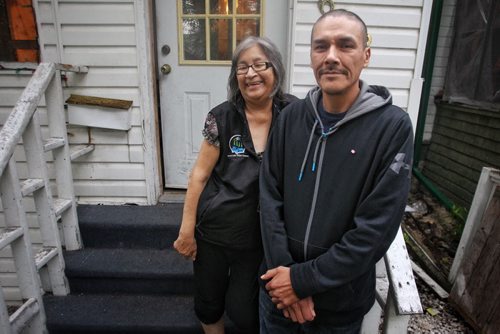 Carol and Caesar Harper, Rinelle Harpers grandmother and father outside the house they are renting in Winnipeg. Their home in Garden Hill burned down recently and the summer jobs they had lined up are gone now because they have nowhere to live in Garden Hill.  150723 July 23, 2015 MIKE DEAL / WINNIPEG FREE PRESS