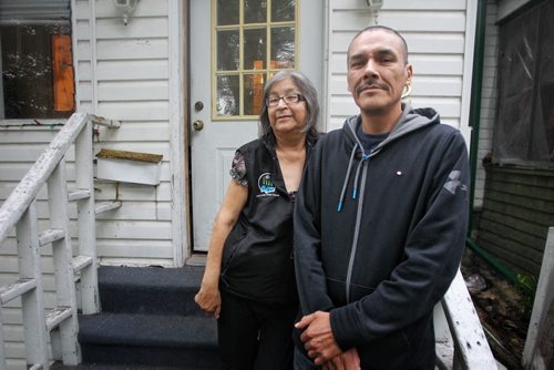 Carol and Caesar Harper, Rinelle Harpers grandmother and father outside the house they are renting in Winnipeg. Their home in Garden Hill burned down recently and the summer jobs they had lined up are gone now because they have nowhere to live in Garden Hill.  150723 July 23, 2015 MIKE DEAL / WINNIPEG FREE PRESS