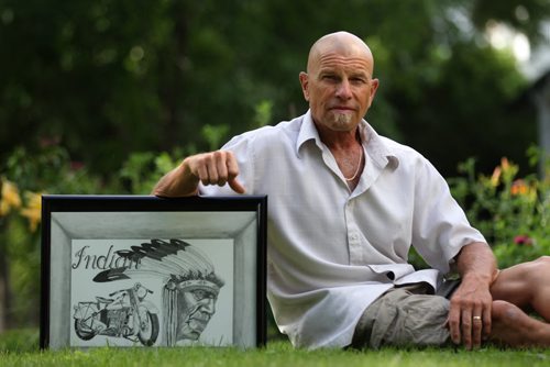 Phil Loewen holds a sketch by an inmate he visits in Stony through a program called Open Circle whereby volunteers befriend inmates and visit them regularly so they aren't forgotten.   See Carol Sanders story.     July 23,, 2015 Ruth Bonneville / Winnipeg Free Press