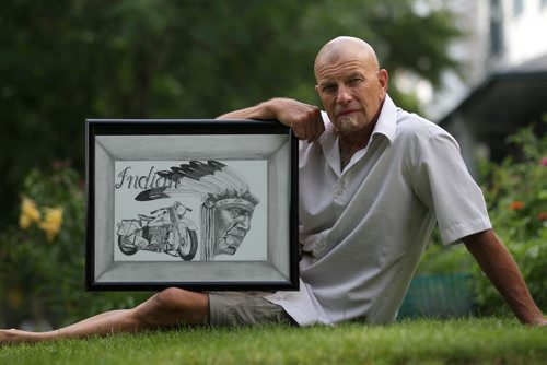 Phil Loewen holds a sketch by an inmate he visits in Stony through a program called Open Circle whereby volunteers befriend inmates and visit them regularly so they aren't forgotten.   See Carol Sanders story.     July 23,, 2015 Ruth Bonneville / Winnipeg Free Press