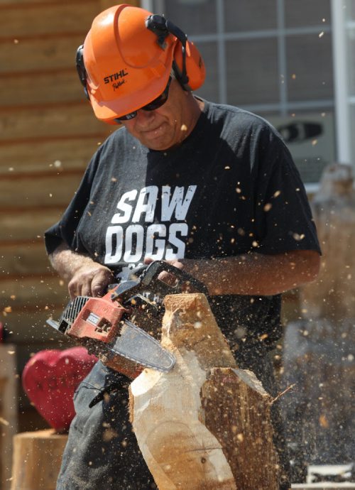 Russ Kubara displays his techniques on how to carve wood with a chainsaw at Tyndall Firewood Supply Ltd near Tyndall, Manitoba  - He teaches workshops in spring and fall-See David Sanderson story- July 23, 2015   (JOE BRYKSA / WINNIPEG FREE PRESS)