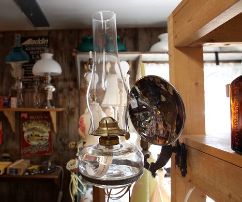 Dugald, Manitoba- Bud McIvor of Ol Lampliter Antique shop specializes in old lamps including this old wall mounted model. He supplies the lanterns around the world, and to cottagers, and TV and movie productions.-See Bill Redekop story- July 23, 2015   (JOE BRYKSA / WINNIPEG FREE PRESS)