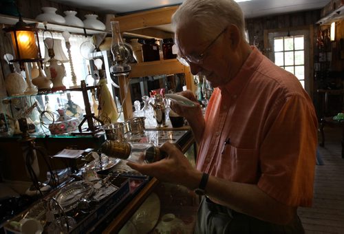 Dugald, Manitoba- Bud McIvor of Ol Lampliter Antique shop specializes in old lamps. He supplies the lanterns around the world, and to cottagers, and TV and movie productions.-See Bill Redekop story- July 23, 2015   (JOE BRYKSA / WINNIPEG FREE PRESS)