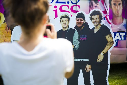 One direction fan Paulina Silva gets her photo taken before the show at the Investors Group Field in Winnipeg on Friday, July 24, 2015.  Mikaela MacKenzie / Winnipeg Free Press