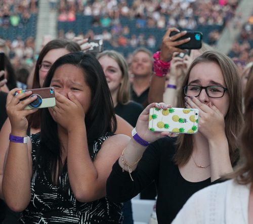 Fans cry as One Direction takes the stage at Investors Group Field July 24, 2015. July 24, 2015 - MELISSA TAIT / WINNIPEG FREE PRESS