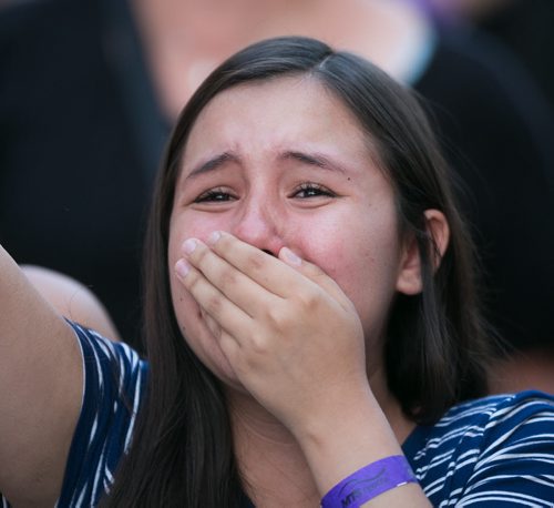 A young fan cries as One Direction takes the stage at Investors Group Field. July 24, 2015 - MELISSA TAIT / WINNIPEG FREE PRESS