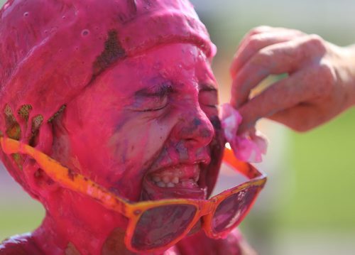 Declan Petrash, 8, has coloured gel wiped off his face following the Colour Me Rad 5km run at the Red River Ex grounds, Saturday, July 25, 2015. (TREVOR HAGAN/WINNIPEG FREE PRESS)