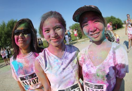 Ester Agustin, Eunique Agustin, 22, and Carla Agustin, 21, after the Colour Me Rad 5km run at the Red River Ex grounds, Saturday, July 25, 2015. (TREVOR HAGAN/WINNIPEG FREE PRESS)