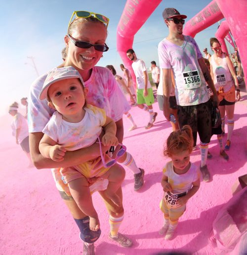 Sian Proulx, with her daughters, Amelie, 1, and Rhiannon, 3, during the Colour Me Rad 5km run at the Red River Ex grounds, Saturday, July 25, 2015. (TREVOR HAGAN/WINNIPEG FREE PRESS)