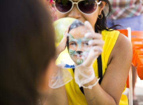 Jordan Girouard, 6, gets his face painted at the No Stone Unturned event in honouring Manitobas missing and murdered at the Forks in Winnipeg on Saturday, July 25, 2015.  Mikaela MacKenzie / Winnipeg Free Press