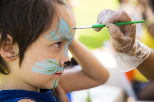 Jordan Girouard, 6, gets his face painted at the No Stone Unturned event in honouring Manitobas missing and murdered at the Forks in Winnipeg on Saturday, July 25, 2015.  Mikaela MacKenzie / Winnipeg Free Press