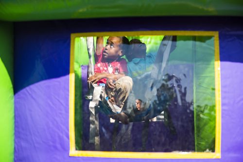 Hussein and Hassan Noor, 6, go up in a bouncy castle at the Eid celebration at the Grand Mosque in Winnipeg on Saturday, July 25, 2015.  Mikaela MacKenzie / Winnipeg Free Press