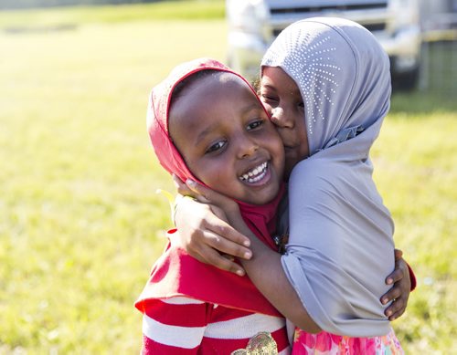 Umayma Farhan (left) and Maryam Ibsa celebrate Eid at the Grand Mosque in Winnipeg on Saturday, July 25, 2015.  Mikaela MacKenzie / Winnipeg Free Press