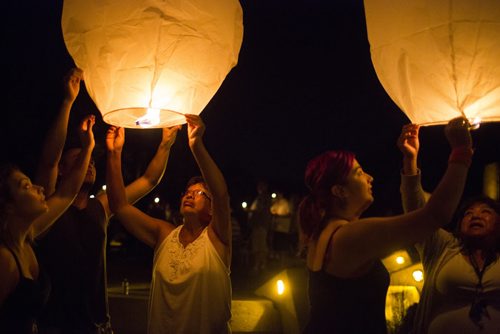 People release lanterns at a candlelit vigil for all missing and murdered at the Forks in Winnipeg on Saturday, July 25, 2015.  Mikaela MacKenzie / Winnipeg Free Press