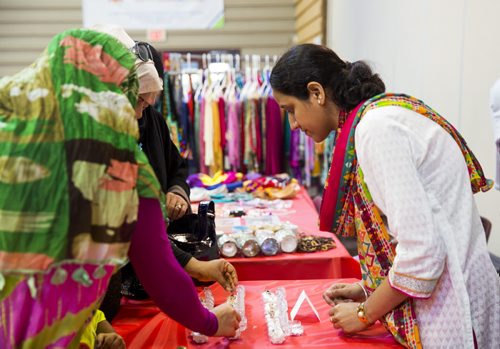 Amber Faisal sells jewellery at the Eid celebration at the Grand Mosque in Winnipeg on Saturday, July 25, 2015.  Mikaela MacKenzie / Winnipeg Free Press