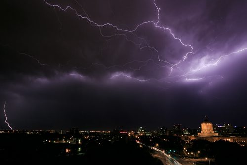 Lightning strikes above the Manitoba Legislative Building around 10:00pm July 26, 2015 during a severe thunderstorm in Winnipeg. July 26, 2015 - MELISSA TAIT / WINNIPEG FREE PRESS