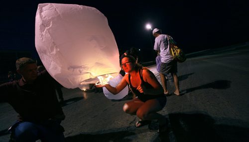 Thelma Krull's daughter Lisa Marquis Besser lights a floating Chinese Lantern at Red River Speedway last night in a vigil to keep search efforts for her missing mom alive. See story. Jauly 27, 2015 - (Phil Hossack / Winnipeg Free Press)   Thelma Krulls family is pressing ahead with efforts to keep the search for the missing 57-year-old grandmother in the news.  "Were reviewing everything at the moment," Krull's daughter Lisa Marquis Besser said Monday.   Thelma Krull CP Thelma Krull Besser said shes meeting with police later today, and at the familys request and weather permitting, there will be an event at the Red River Speedway tonight to publicize the ongoing search.  "I asked for the meeting with police," Besser said, "To touch base, to see what different things (to do) and what we can rule out."  Around 9:30 p.m., following the races are over at the speedway this evening, the family plans to hand out flameless candles in the stands and release Chinese lanterns in an effort to keep attention on Krulls disappearance. That event, which the family is calling Keep the Light On, was originally scheduled for last Thursday but the races were rained out.  As of today, Krull has been missing for 16 straight days.  Despite exhaustive searches, nothing has been reported publicly to advance the case and the family is desperate to find the missing woman.  "Two weeks into it, were not sure what were supposed to be doing," Besser said. Krull was last seen at 7:23 a.m. on July 11, leaving her home in Harbourview South to go for a walk in the Valley Gardens area. She had been taking long walks recently in preparation to go hiking in B.C. later this summer, but she missed her grandson's birthday and her family has said it's extremely out of character for her not to be in contact with them.  Krull's glasses were found in the Valley Gardens area July 15. Police said investigators recovered other items, but wouldn't confirm whether they belonged to Krull.  By th