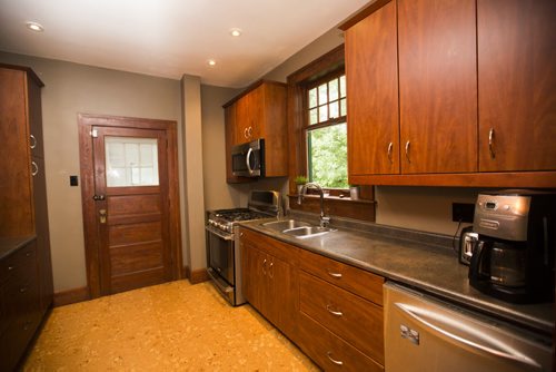 A modern galley-style kitchen adds functionality to this Riverview home in Winnipeg on Tuesday, July 28, 2015.  Mikaela MacKenzie / Winnipeg Free Press