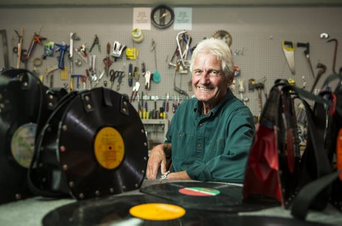 Alf Dick, volunteer at the MCC thrift store, makes purses out of old vinyl records in Winnipeg on Tuesday, July 28, 2015.  Mikaela MacKenzie / Winnipeg Free Press